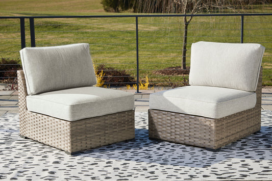 Calworth - Beige - Armless Chair w/Cushion (Set of 2) - Hornell Furniture Outlet
