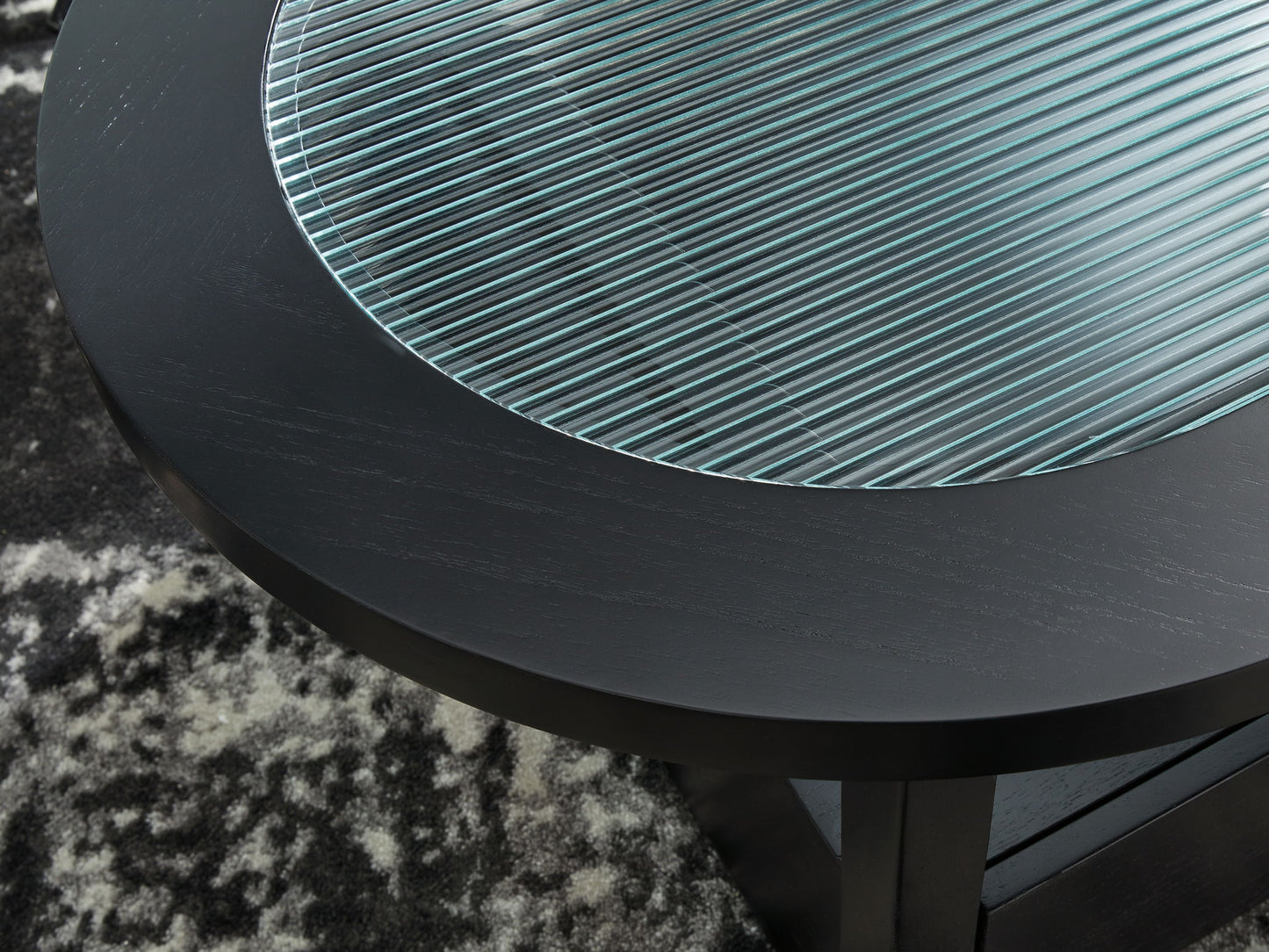 Winbardi - Black - Oval Cocktail Table - Hornell Furniture Outlet