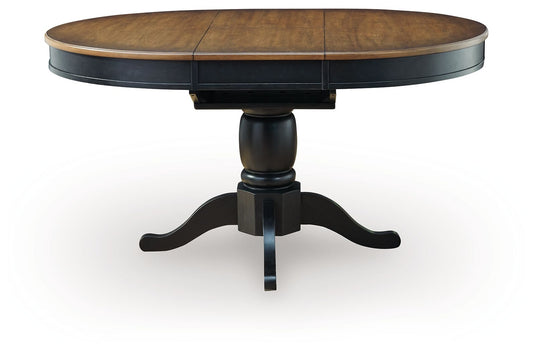 Clorazi - Oval Dining Room Butterfly Extension Table - Black / Brown - Hornell Furniture Outlet