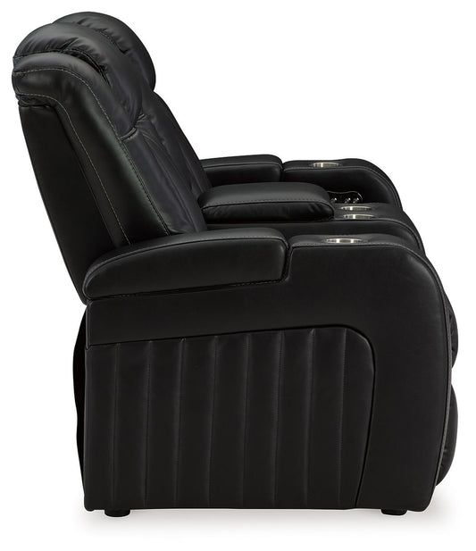 Caveman Den - Midnight - Power Reclining Loveseat with Console/ Adj Hdrst - Hornell Furniture Outlet