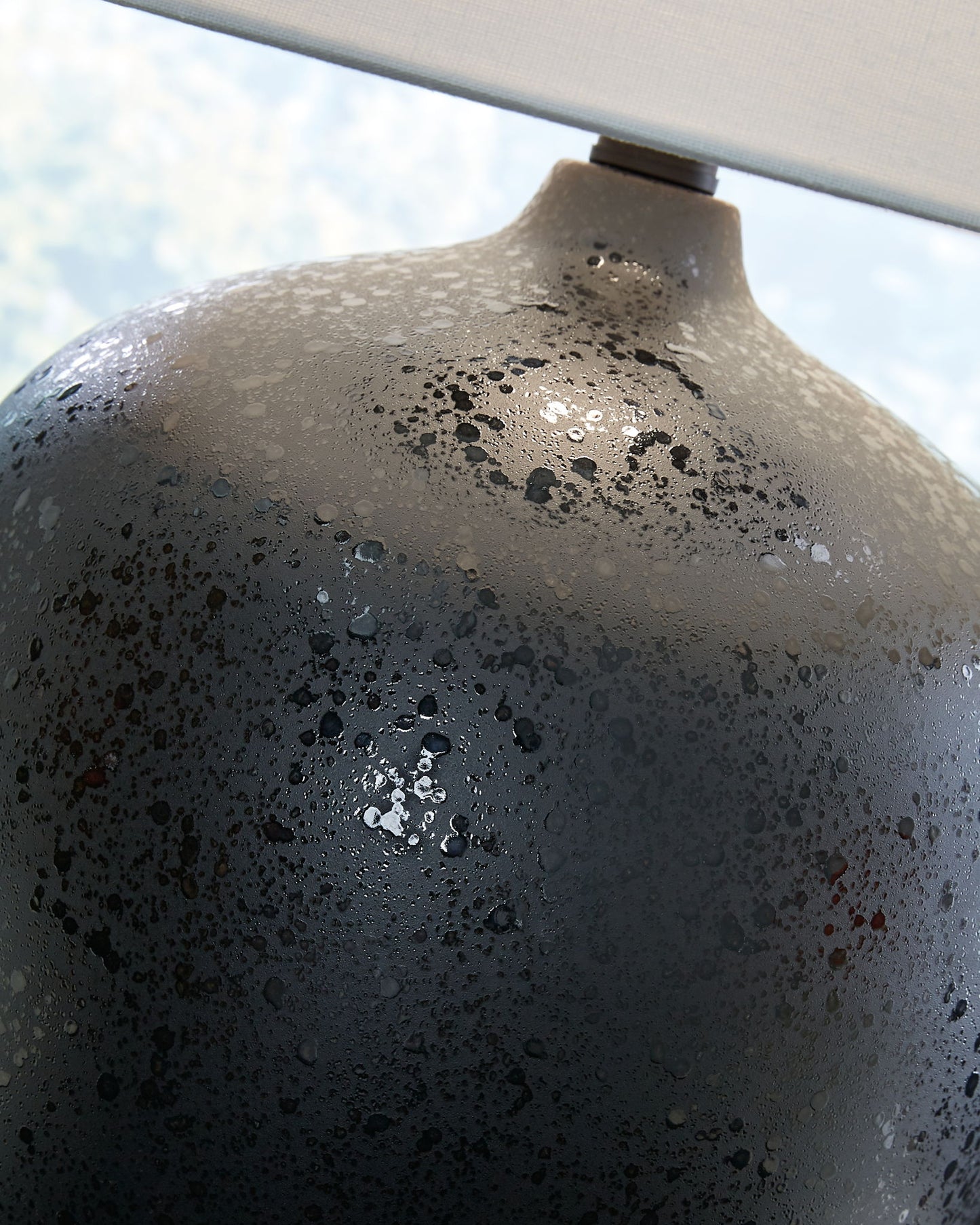 Ladstow - Black - Ceramic Table Lamp - Hornell Furniture Outlet