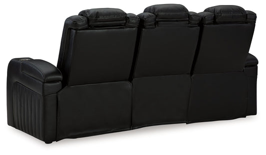 Caveman Den - Midnight - Power Reclining Sofa With Adj Headrest - Hornell Furniture Outlet