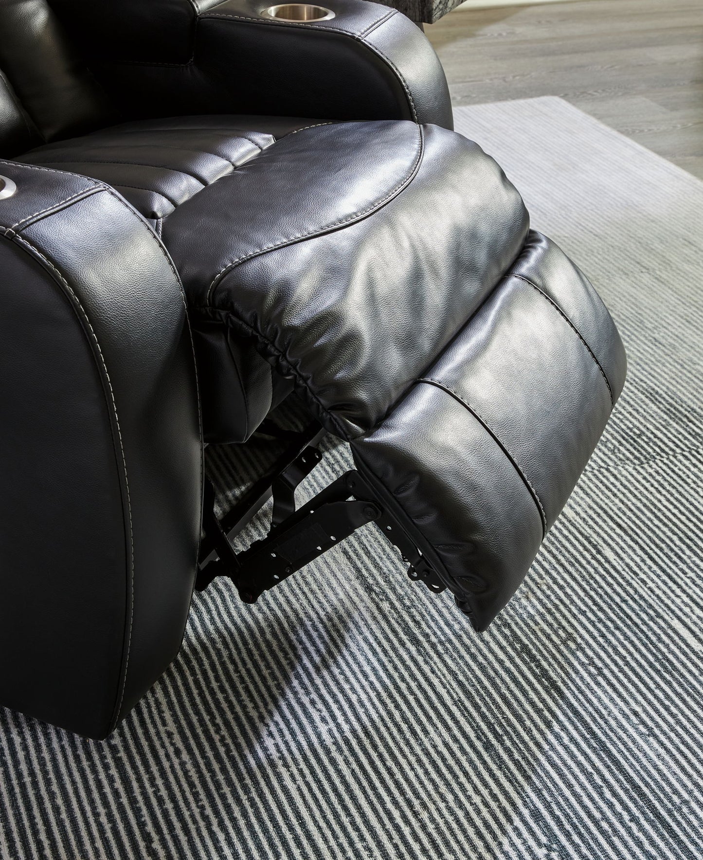 Caveman Den - Midnight - Power Reclining Loveseat with Console/ Adj Hdrst - Hornell Furniture Outlet