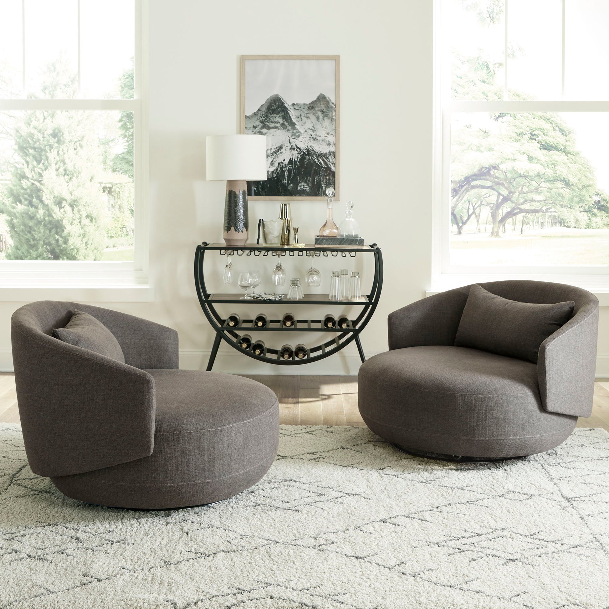 Haley - Upholstered Swivel Cuddler Chair - Hornell Furniture Outlet