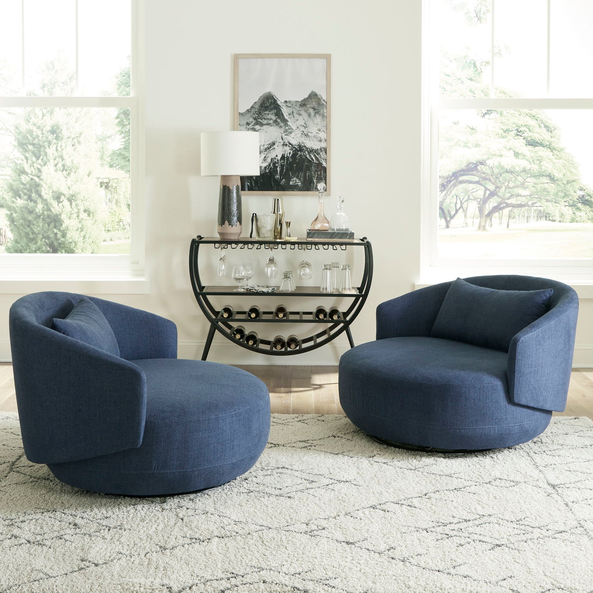 Haley - Upholstered Swivel Cuddler Chair - Hornell Furniture Outlet