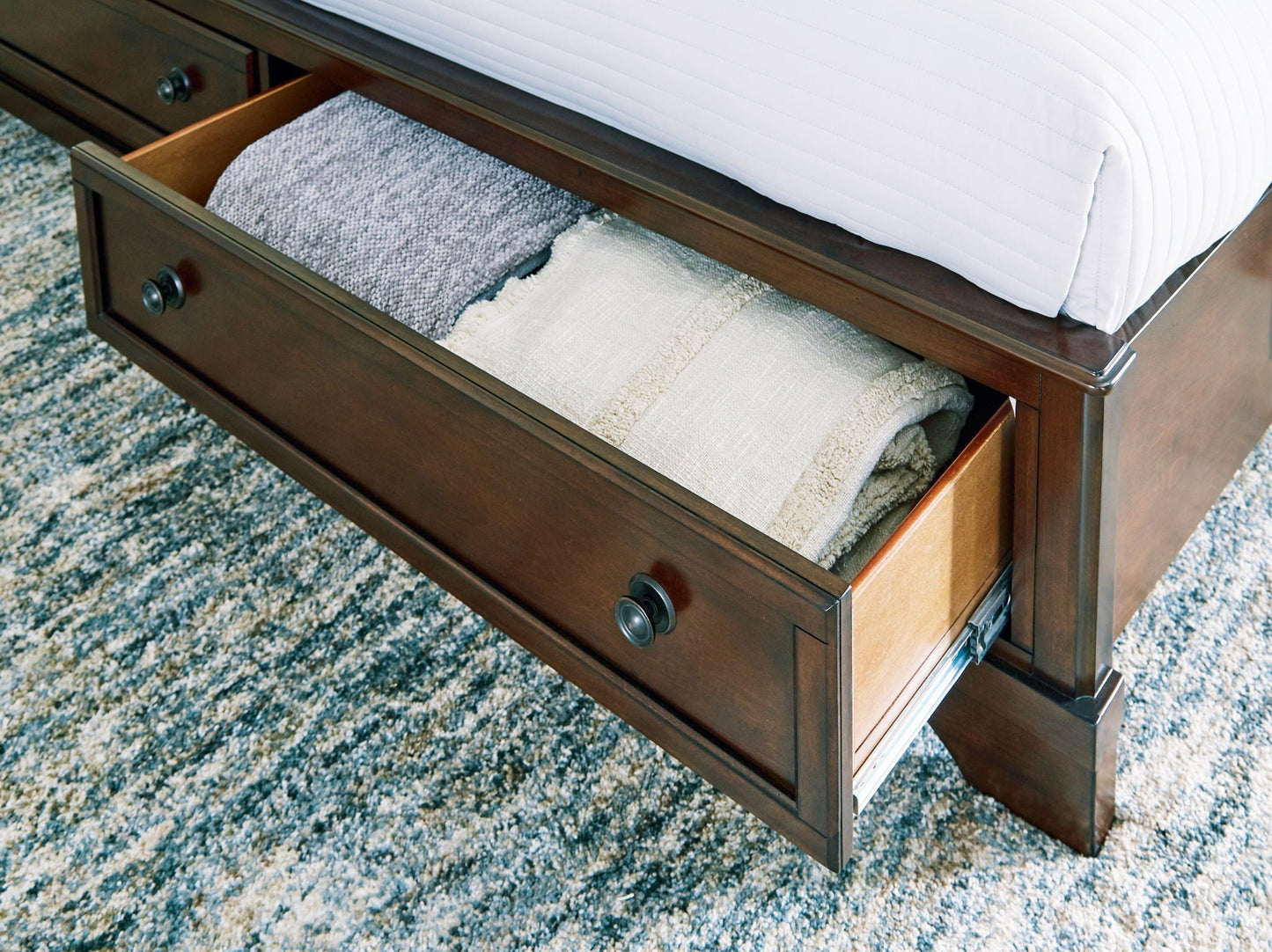 Trellington - Brown - King Sleigh Storage Bed - Hornell Furniture Outlet