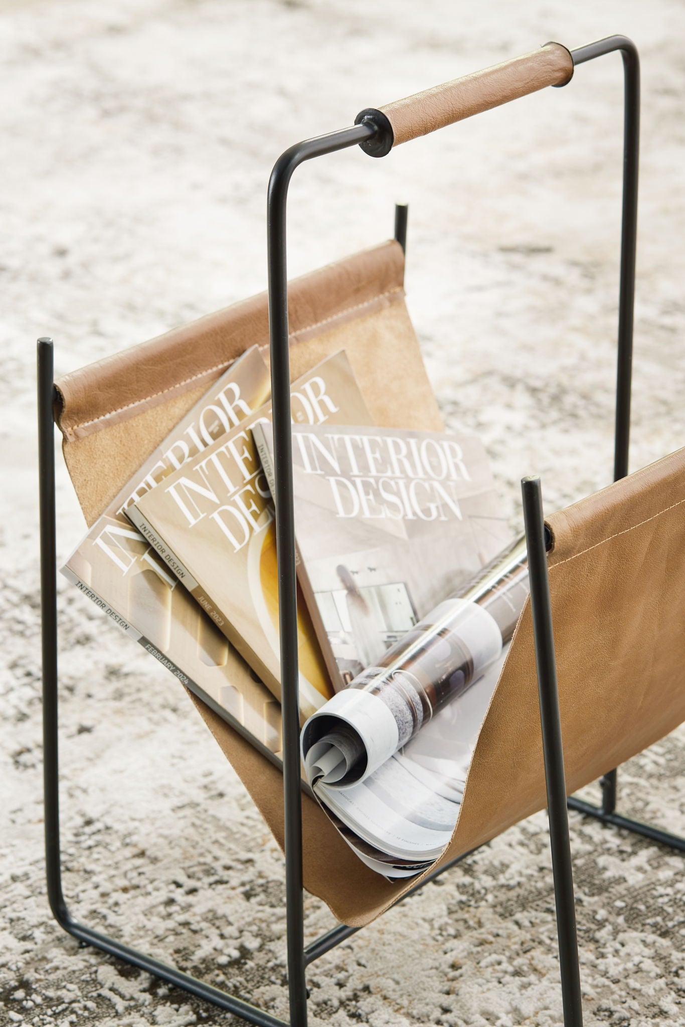 Faronworth - Brown / Black - Magazine Rack - Hornell Furniture Outlet