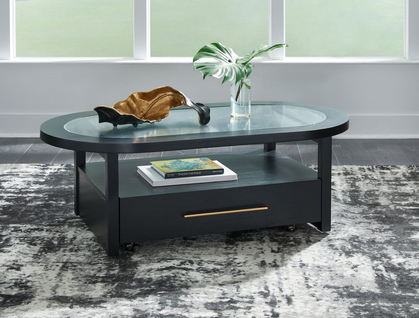 Winbardi - Black - Oval Cocktail Table - Hornell Furniture Outlet
