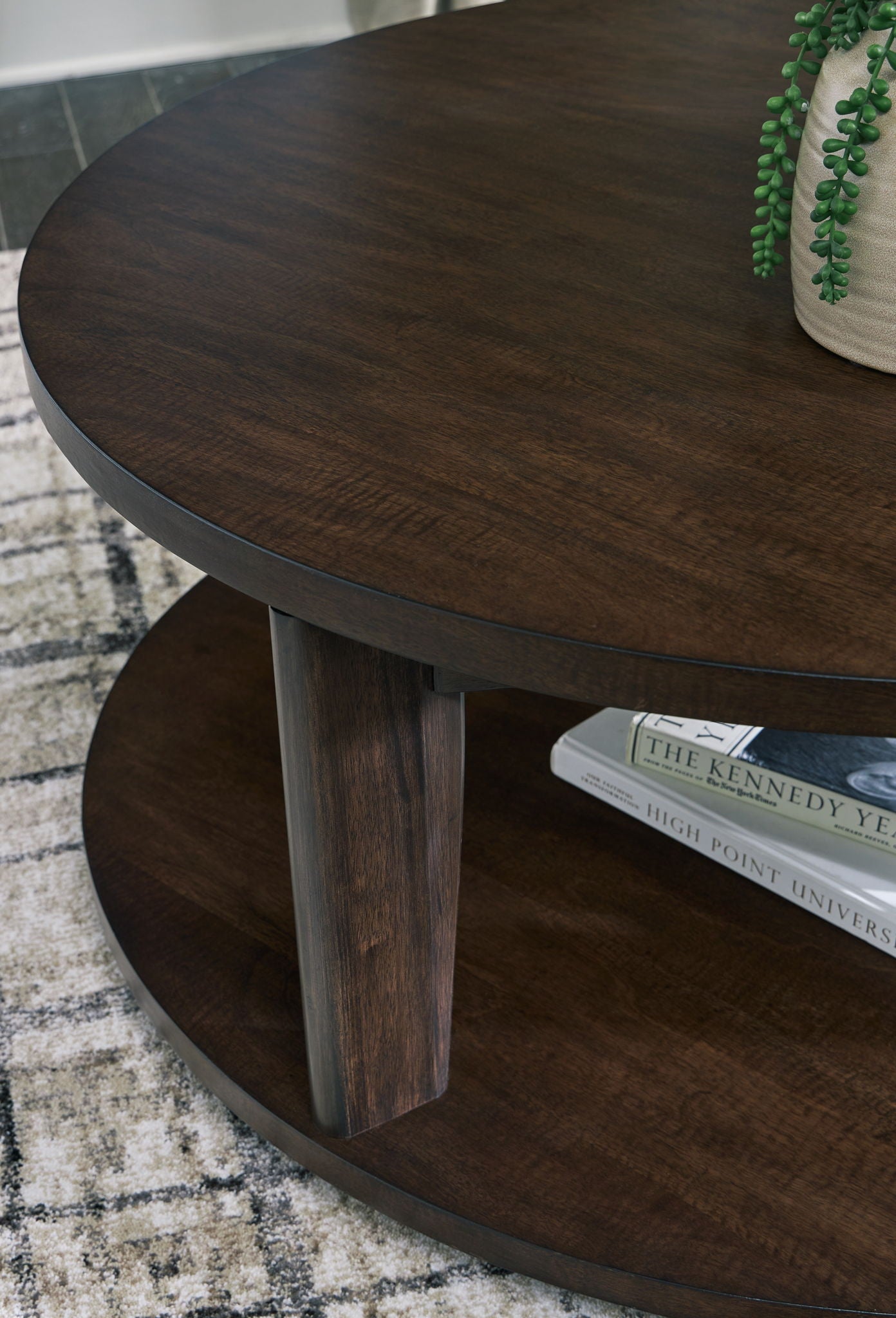 Korestone 2 - Dark Brown - Round Cocktail Table - Hornell Furniture Outlet