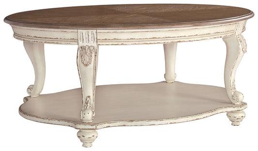 Realyn - White / Brown - Oval Cocktail Table - Hornell Furniture Outlet
