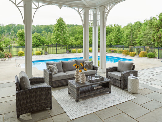Oasis Court - Gray - Sofa, Chairs, Table Set (Set of 4) - Hornell Furniture Outlet