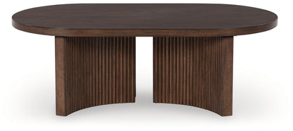Korestone - Dark Brown - Oval Cocktail Table - Hornell Furniture Outlet