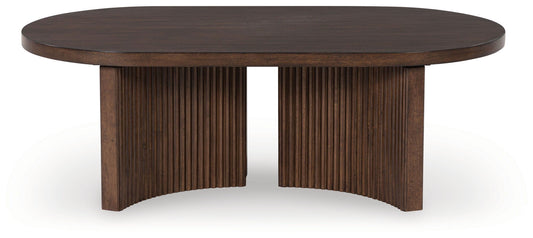 Korestone - Dark Brown - Oval Cocktail Table - Hornell Furniture Outlet
