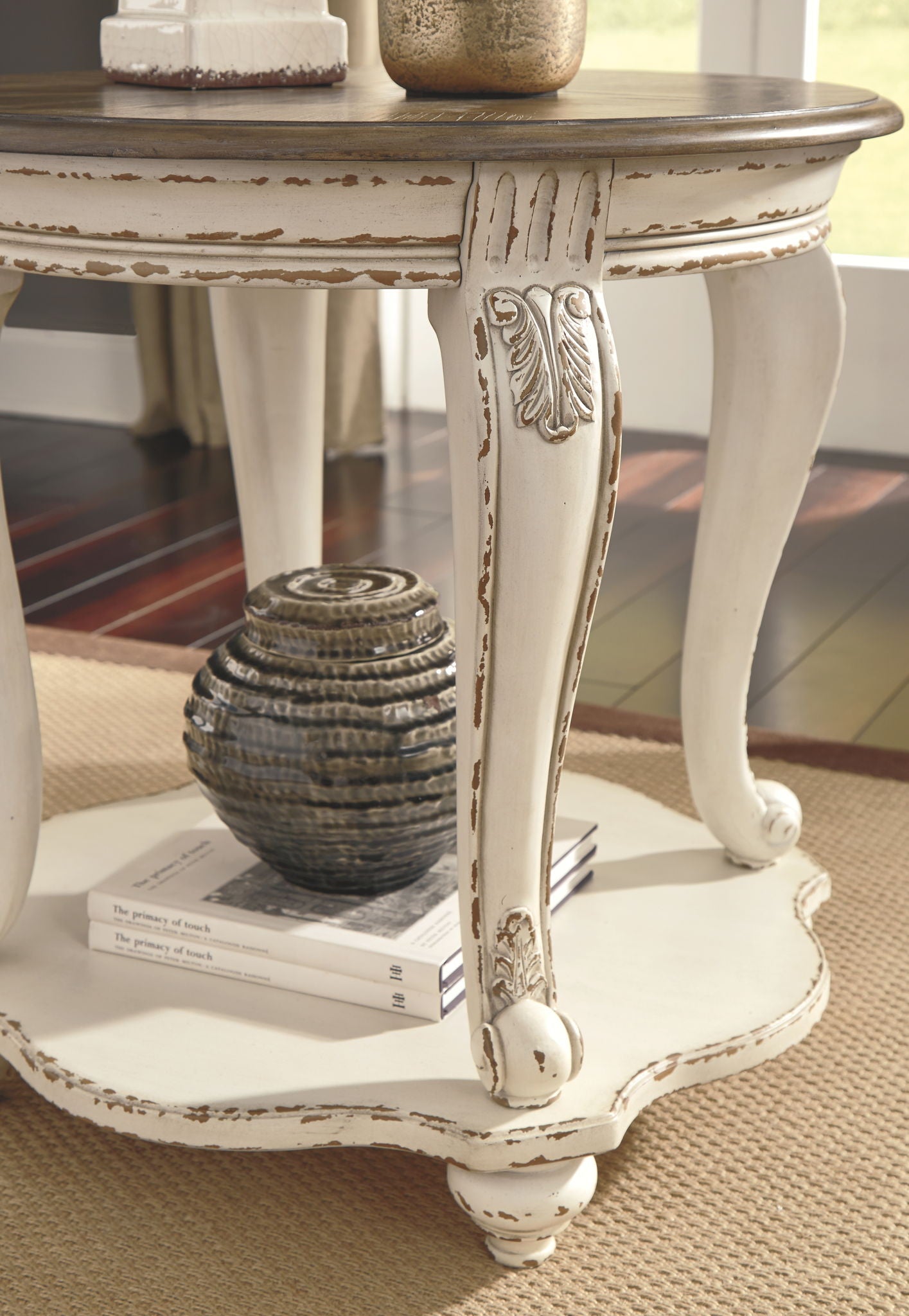 Realyn - White / Brown - Round End Table - Hornell Furniture Outlet