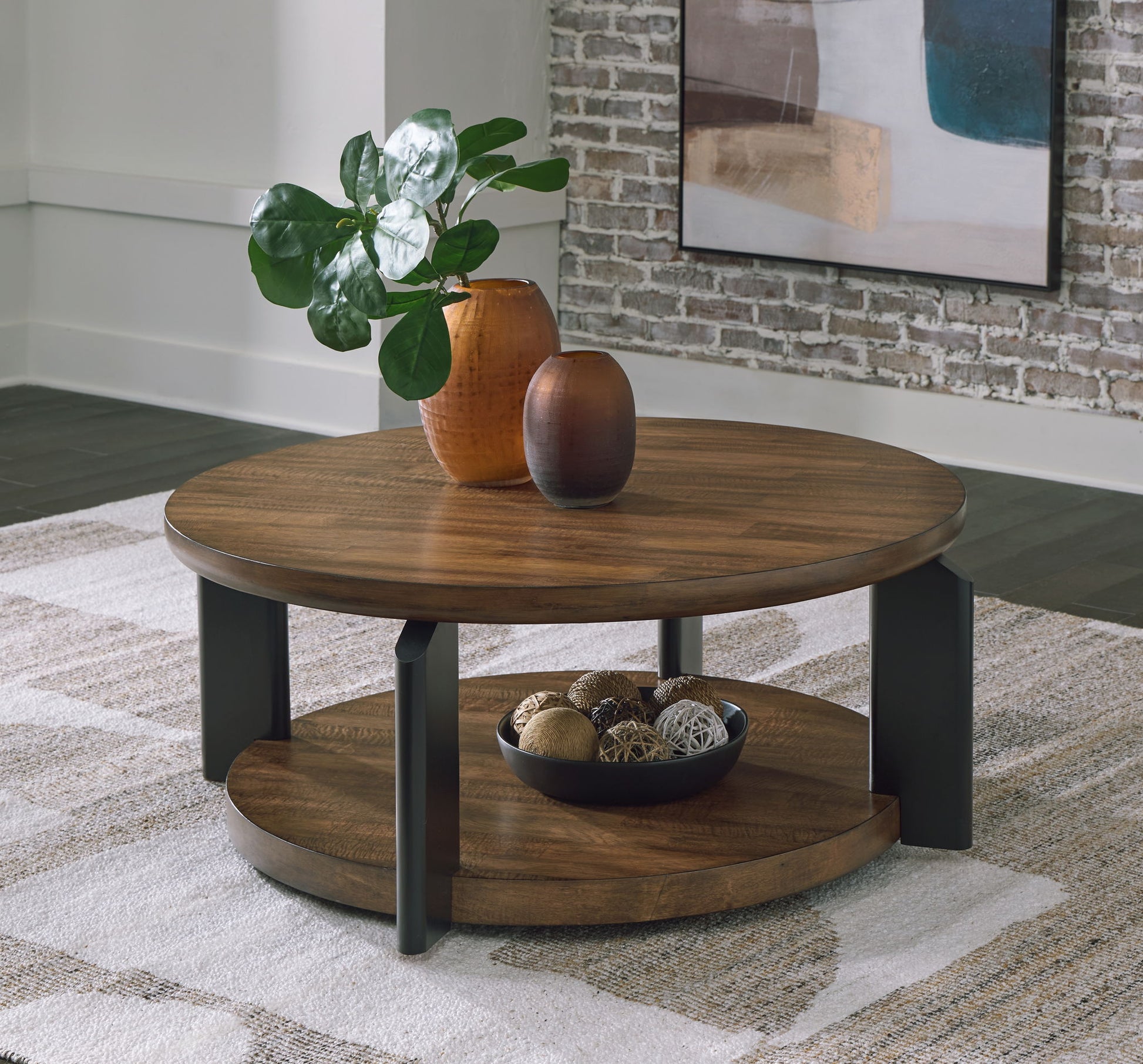 Kraeburn - Brown / Black - Round Cocktail Table - Hornell Furniture Outlet