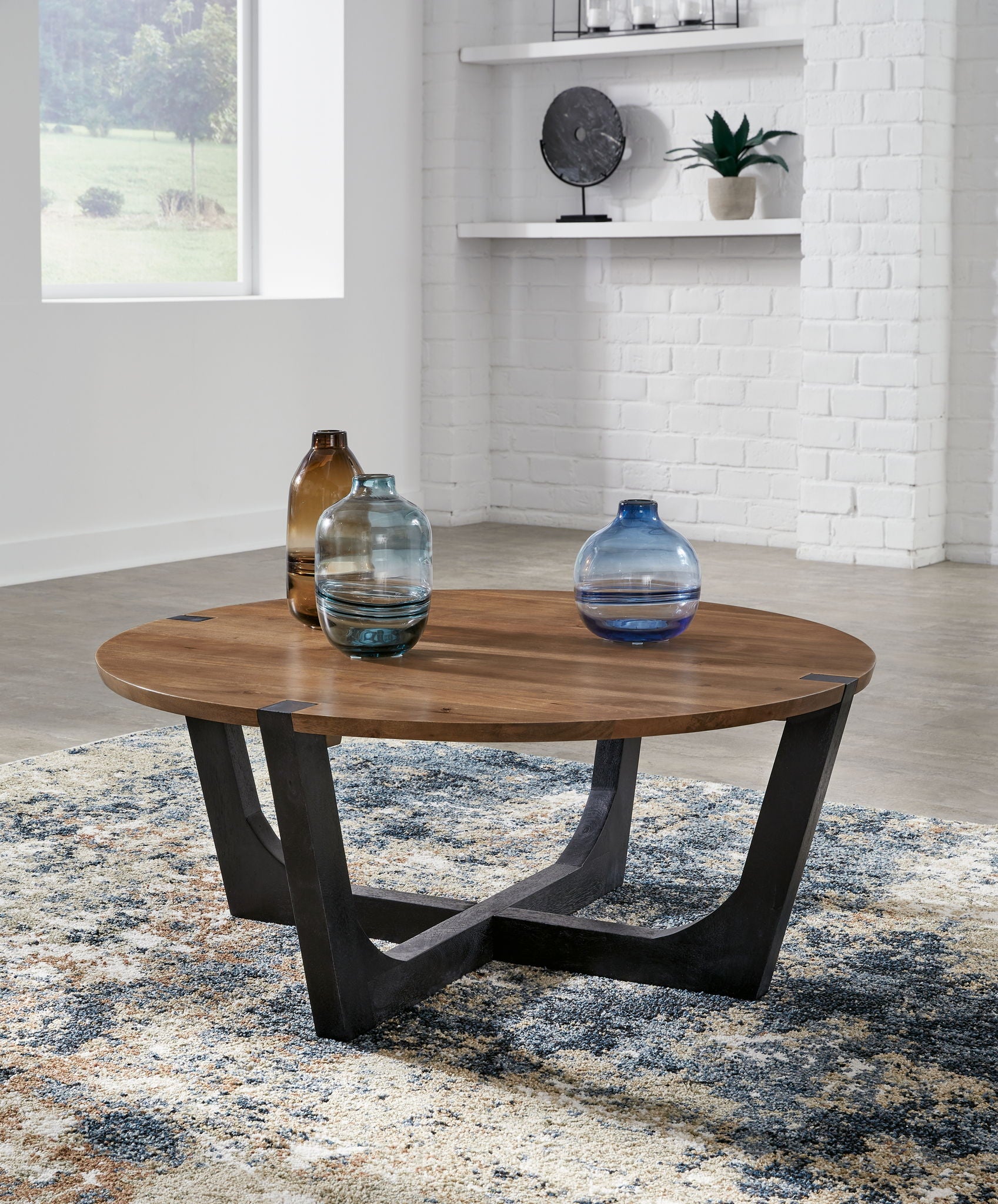 Hanneforth - Round Cocktail Table - Brown - Hornell Furniture Outlet