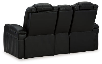 Caveman Den - Midnight - Power Reclining Loveseat with Console/ Adj Hdrst - Hornell Furniture Outlet