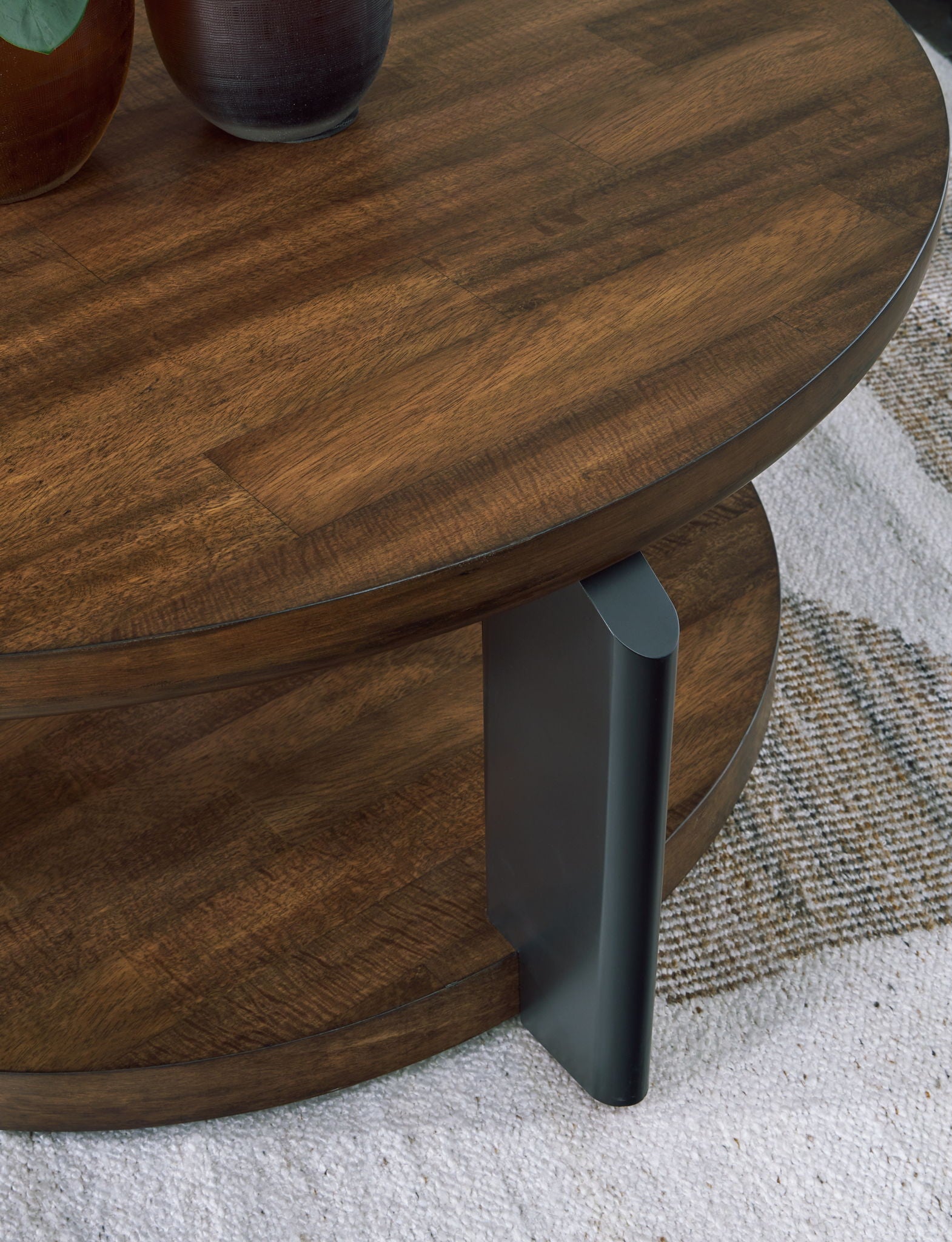 Kraeburn - Brown / Black - Round Cocktail Table - Hornell Furniture Outlet