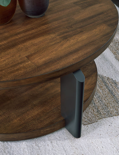 Kraeburn - Brown / Black - Round Cocktail Table - Hornell Furniture Outlet
