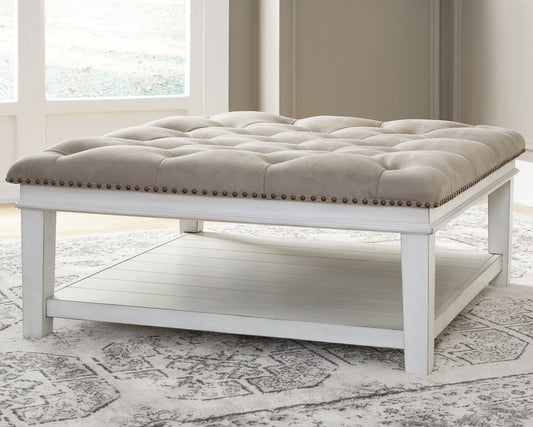 Kanwyn - Whitewash - Uph Ottoman Cocktail Table - Hornell Furniture Outlet