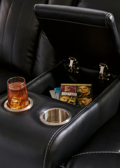 Caveman Den - Midnight - Power Reclining Loveseat with Console/ Adj Hdrst - Hornell Furniture Outlet