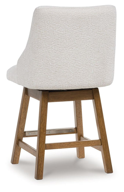 Cabalynn - Oatmeal / Light Brown - Upholstered Swivel Barstool (Set of 2) - Hornell Furniture Outlet