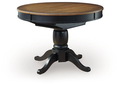Clorazi - Oval Dining Room Butterfly Extension Table - Black / Brown - Hornell Furniture Outlet