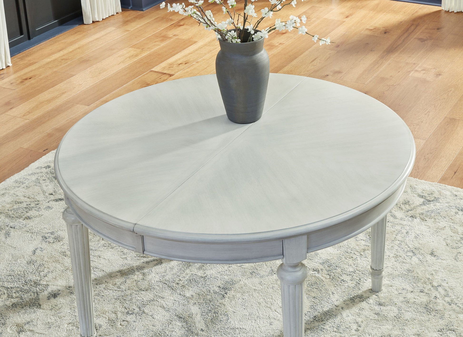 Montelaine - Antique White - Oval Dining Room Extension Table - Hornell Furniture Outlet