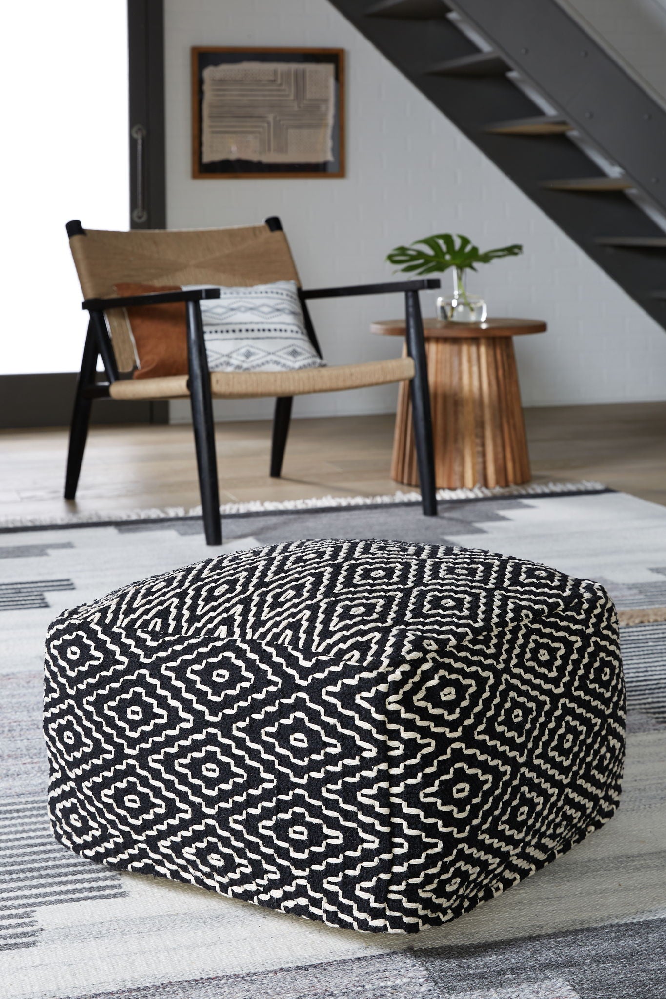 Jasett - Black / Ivory - Pouf - Hornell Furniture Outlet