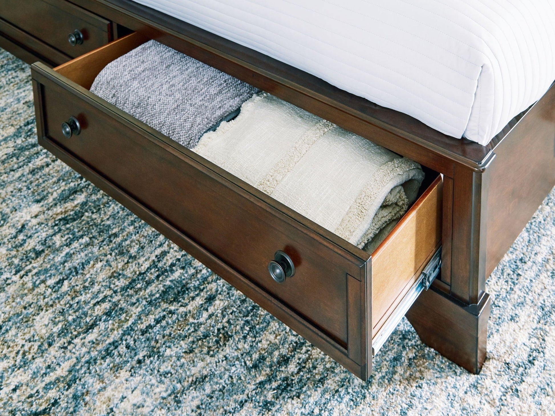 Trellington - Brown - Queen Sleigh Storage Bed - Hornell Furniture Outlet