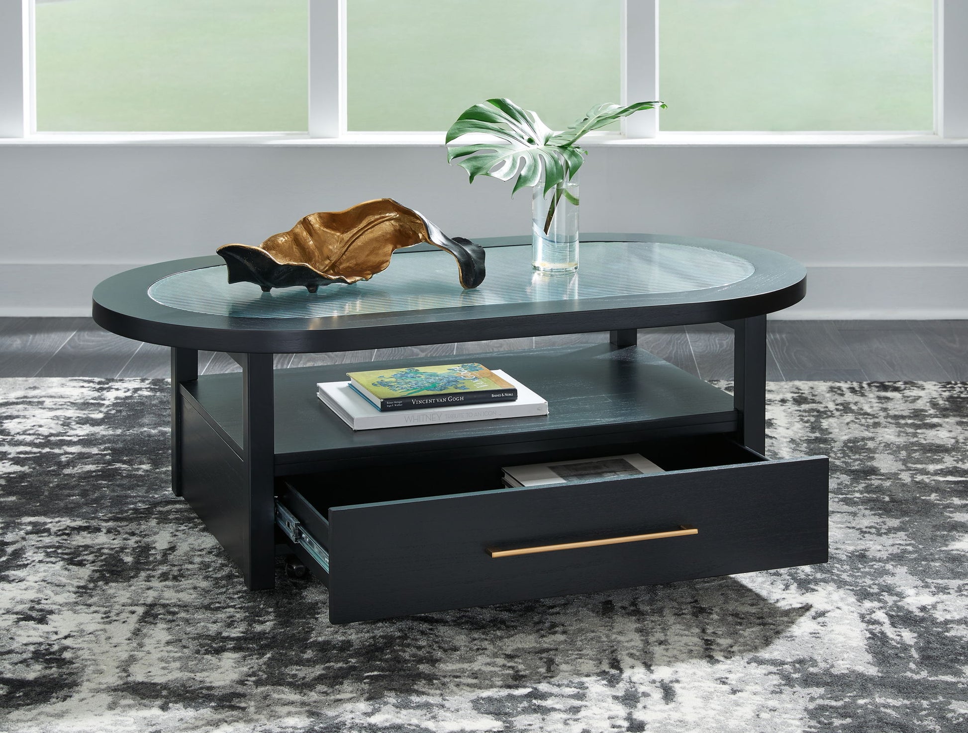 Winbardi - Black - Oval Cocktail Table - Hornell Furniture Outlet