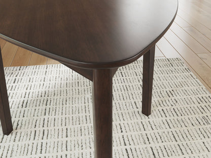 Mallenette - Triangle Dining Room Table - Merlot - Hornell Furniture Outlet