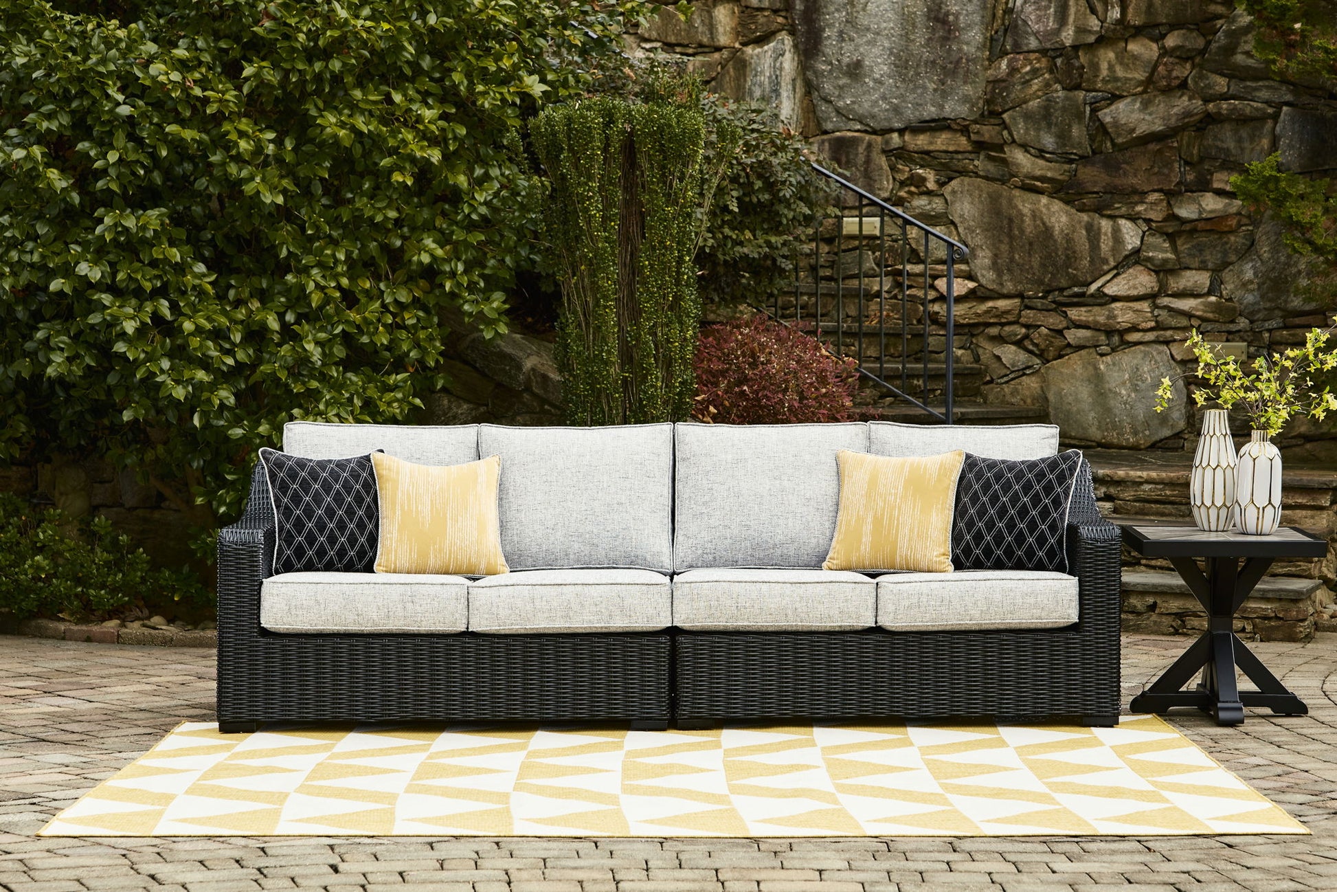 Beachcroft - Black / Light Gray - 2 - Piece Outdoor Loveseat with Cushion - Hornell Furniture Outlet