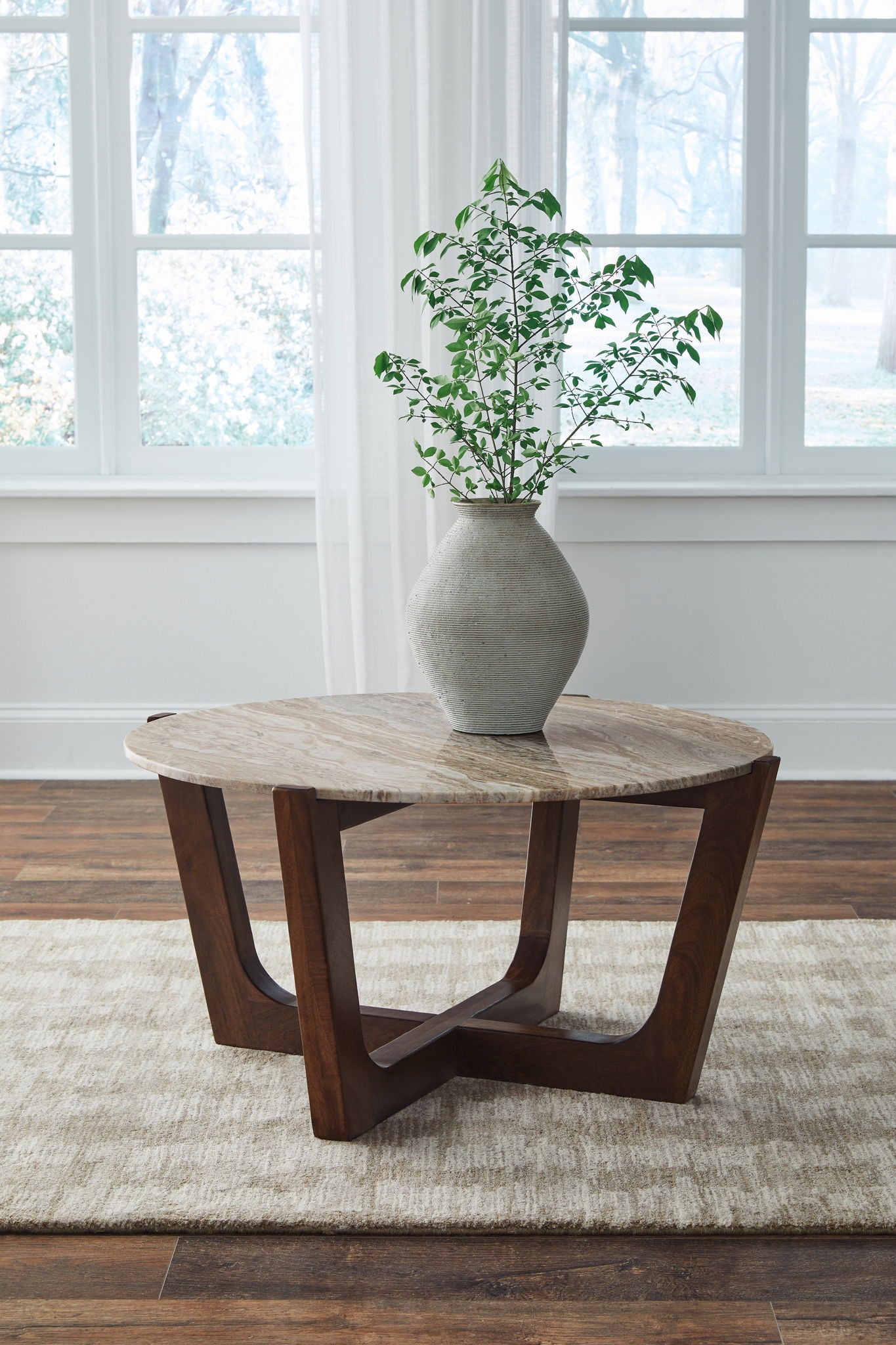 Tanidore - Warm Brown - Round Cocktail Table - Hornell Furniture Outlet