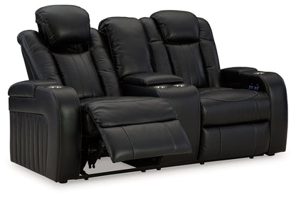 Caveman Den - Midnight - Power Reclining Loveseat with Console/ Adj Hdrst - Hornell Furniture Outlet