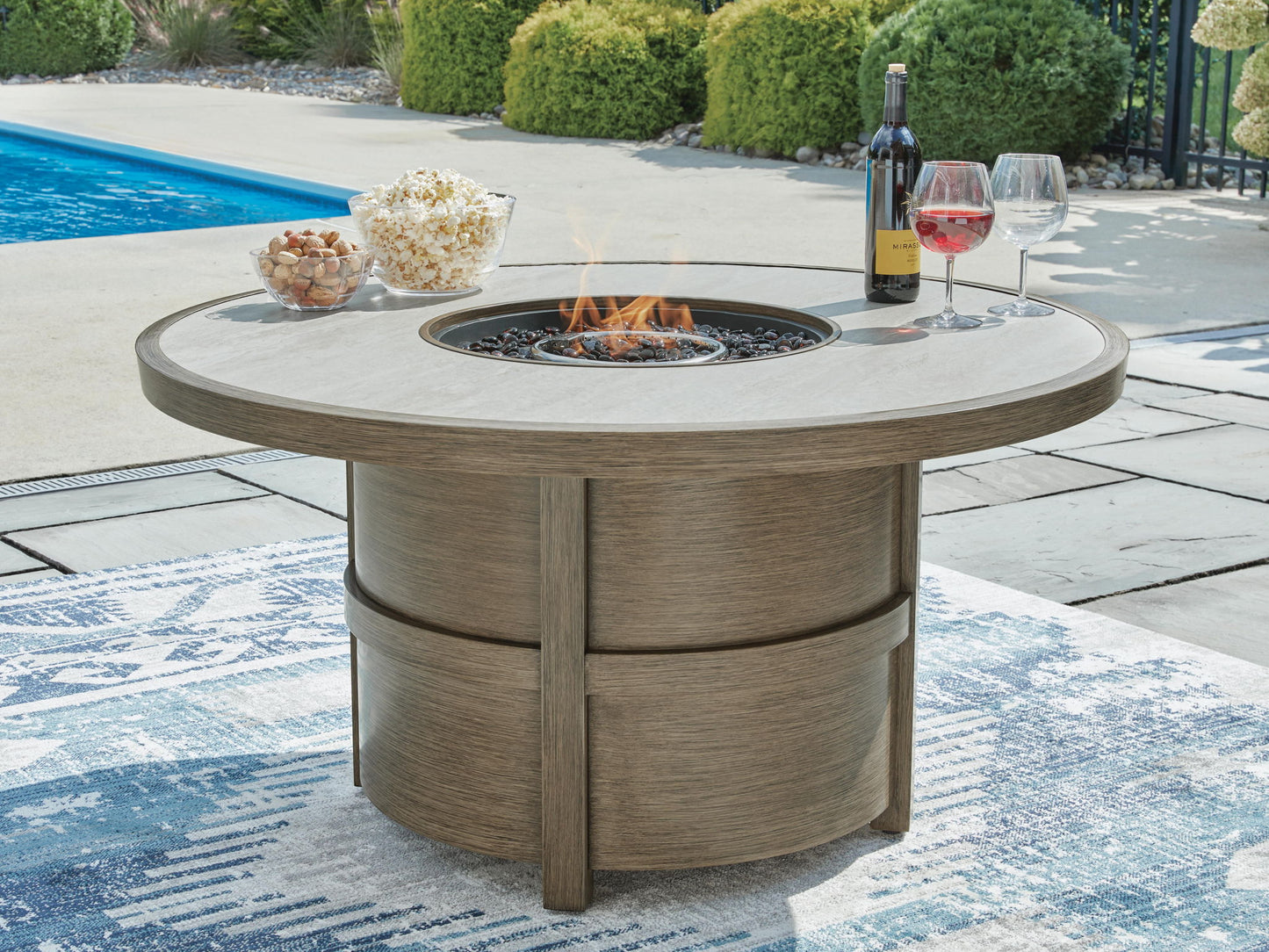 Rainier Ranch - Round Fire Pit Table - Beige - Hornell Furniture Outlet