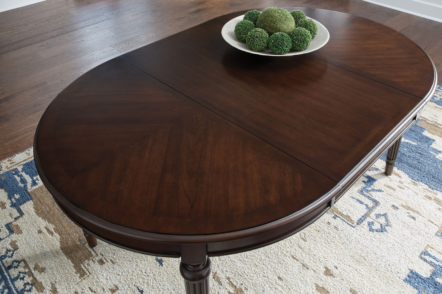 Lavinton - Brown - Oval Dining Room Extension Table - Hornell Furniture Outlet