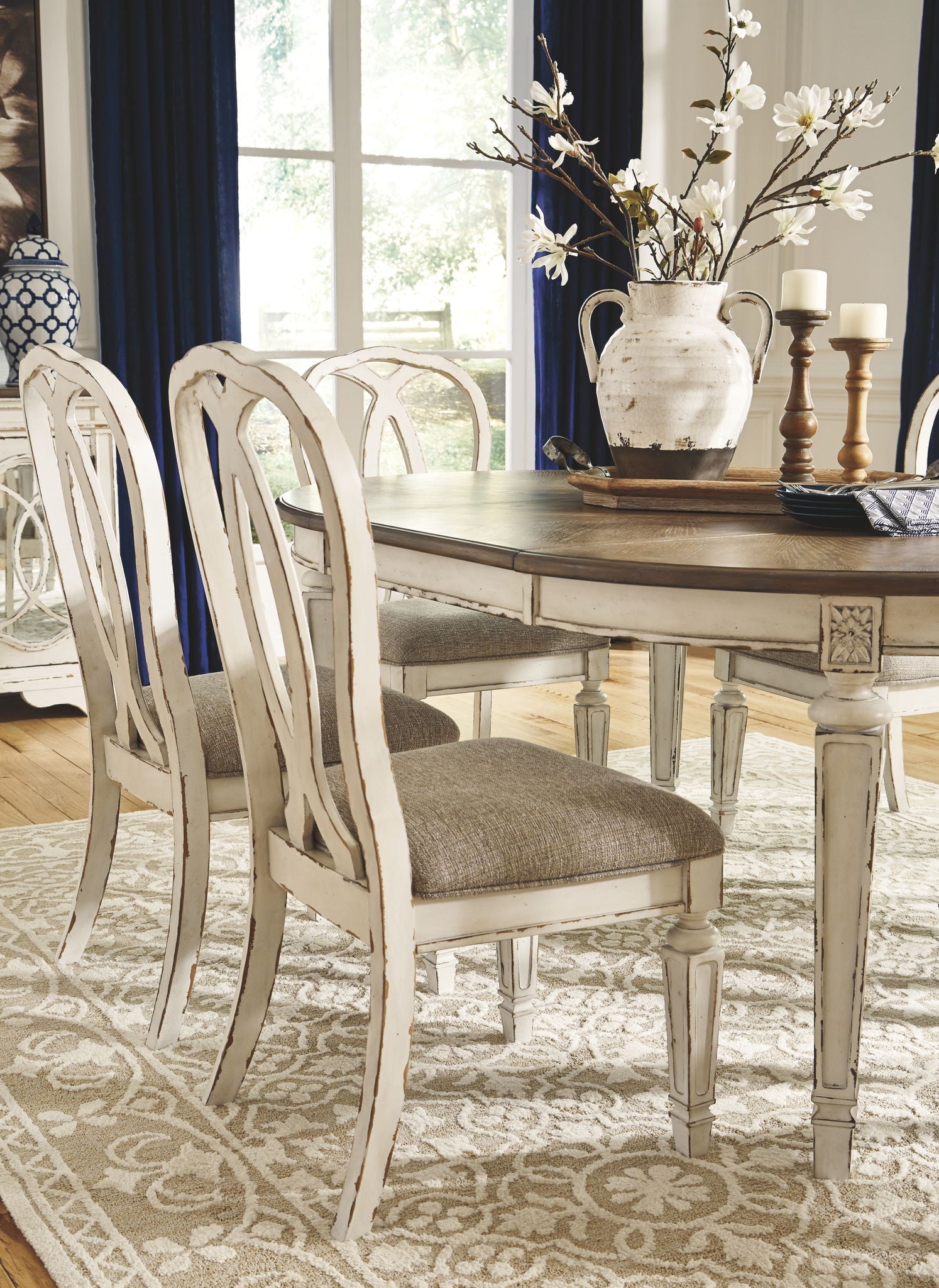Realyn - Oval Dining Table Set - Hornell Furniture Outlet
