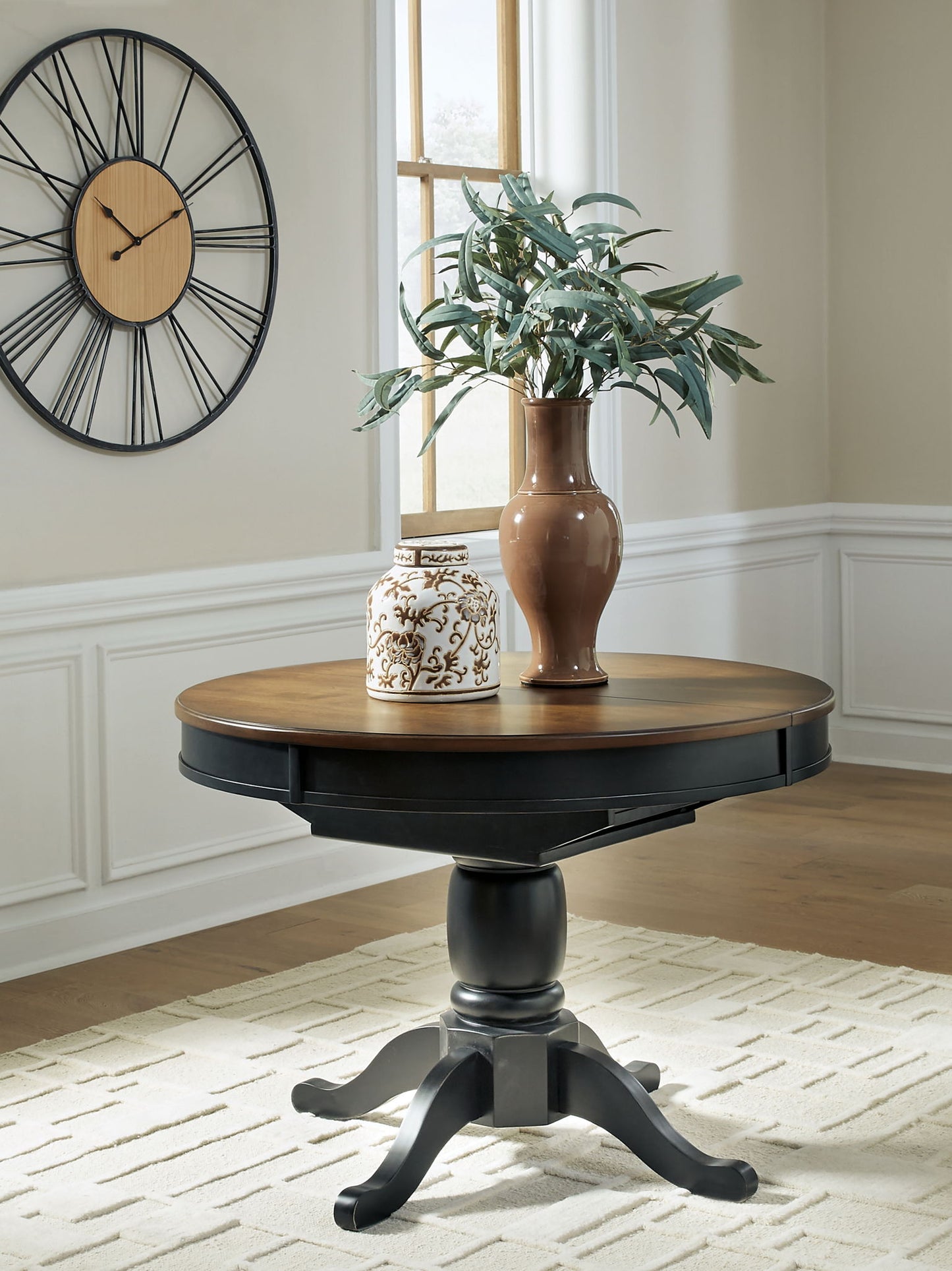Clorazi - Oval Dining Room Butterfly Extension Table - Black / Brown - Hornell Furniture Outlet