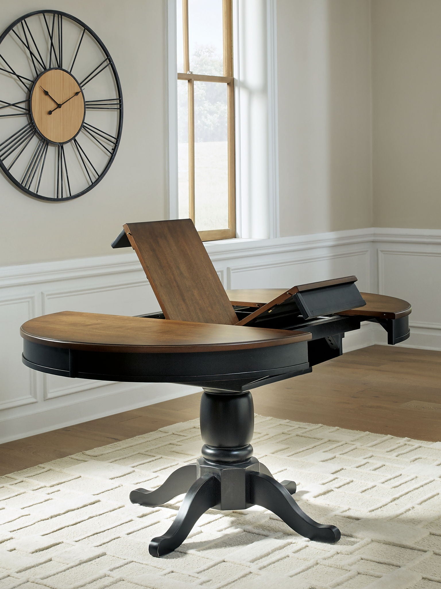 Clorazi - Oval Dining Room Butterfly Extension Table - Black / Brown - Hornell Furniture Outlet