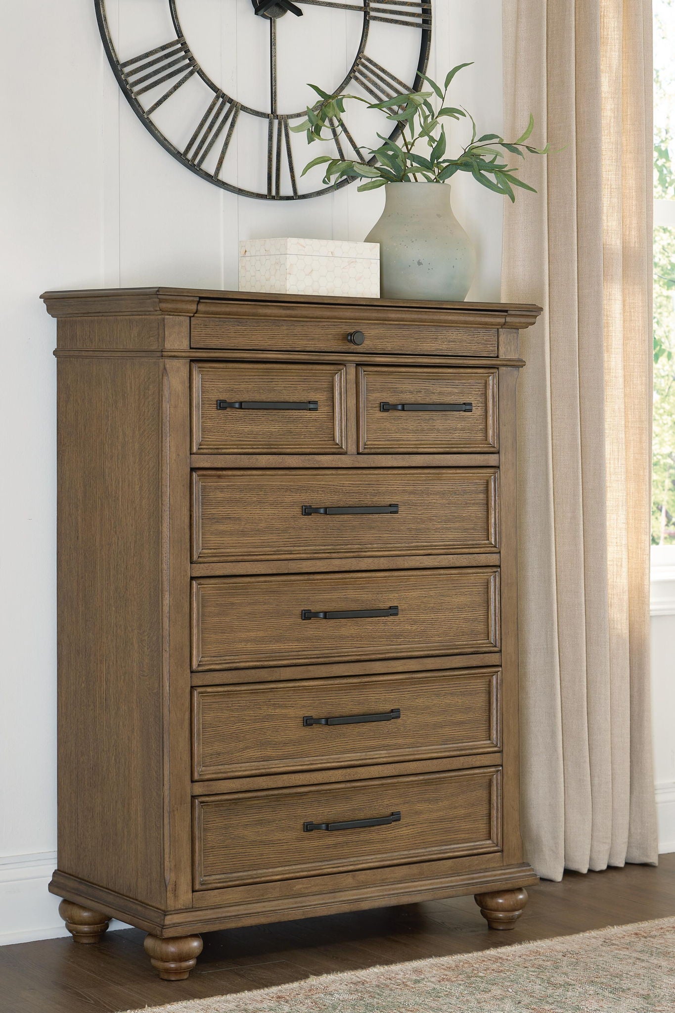 Karallin - Seven Drawer Chest - Medium Brown - Hornell Furniture Outlet