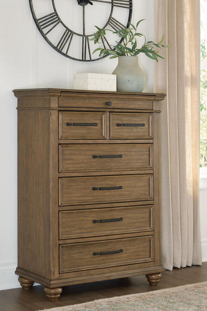 Karallin - Seven Drawer Chest - Medium Brown - Hornell Furniture Outlet