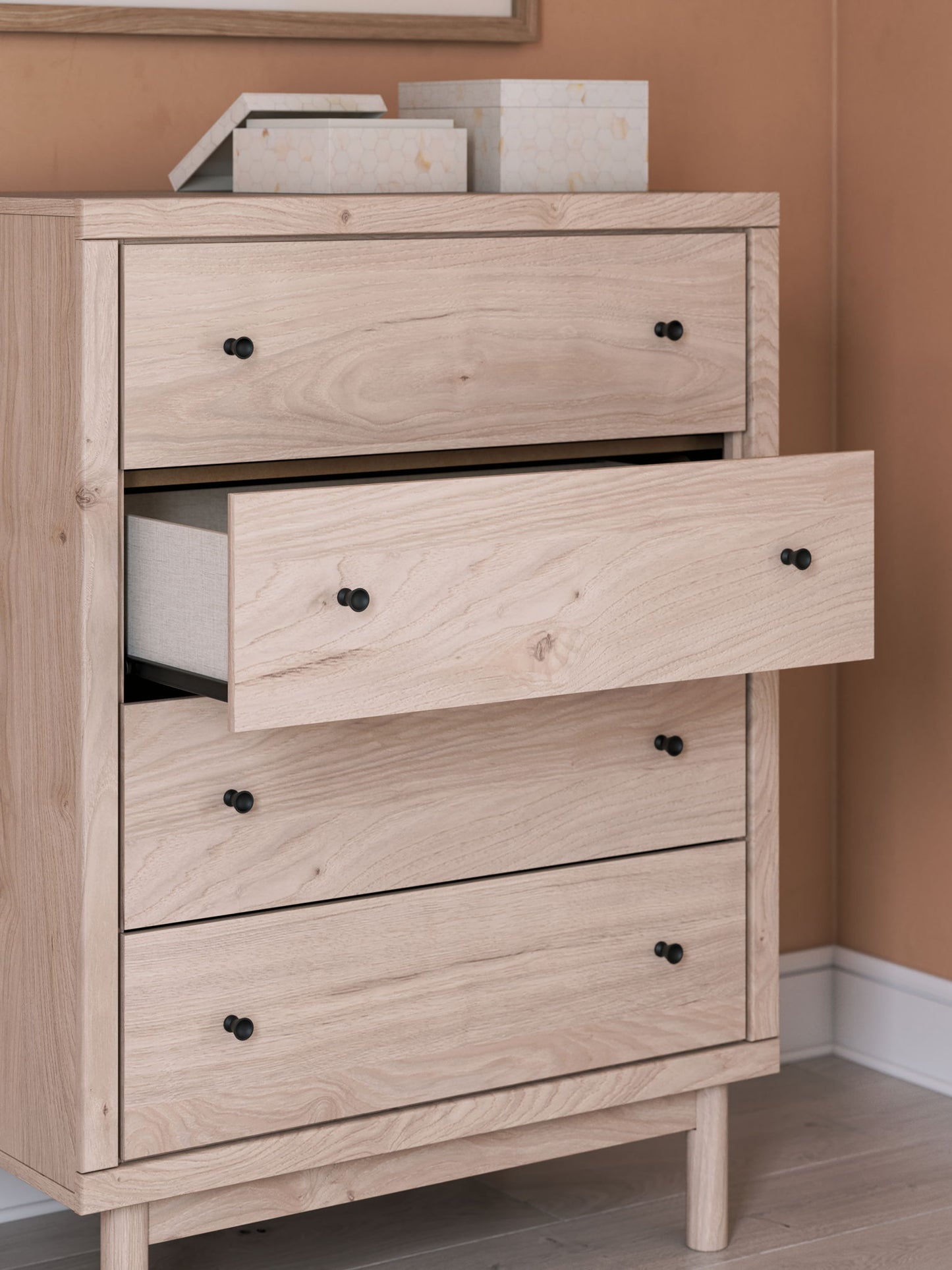 Arloster - Tan - Four Drawer Chest - Hornell Furniture Outlet