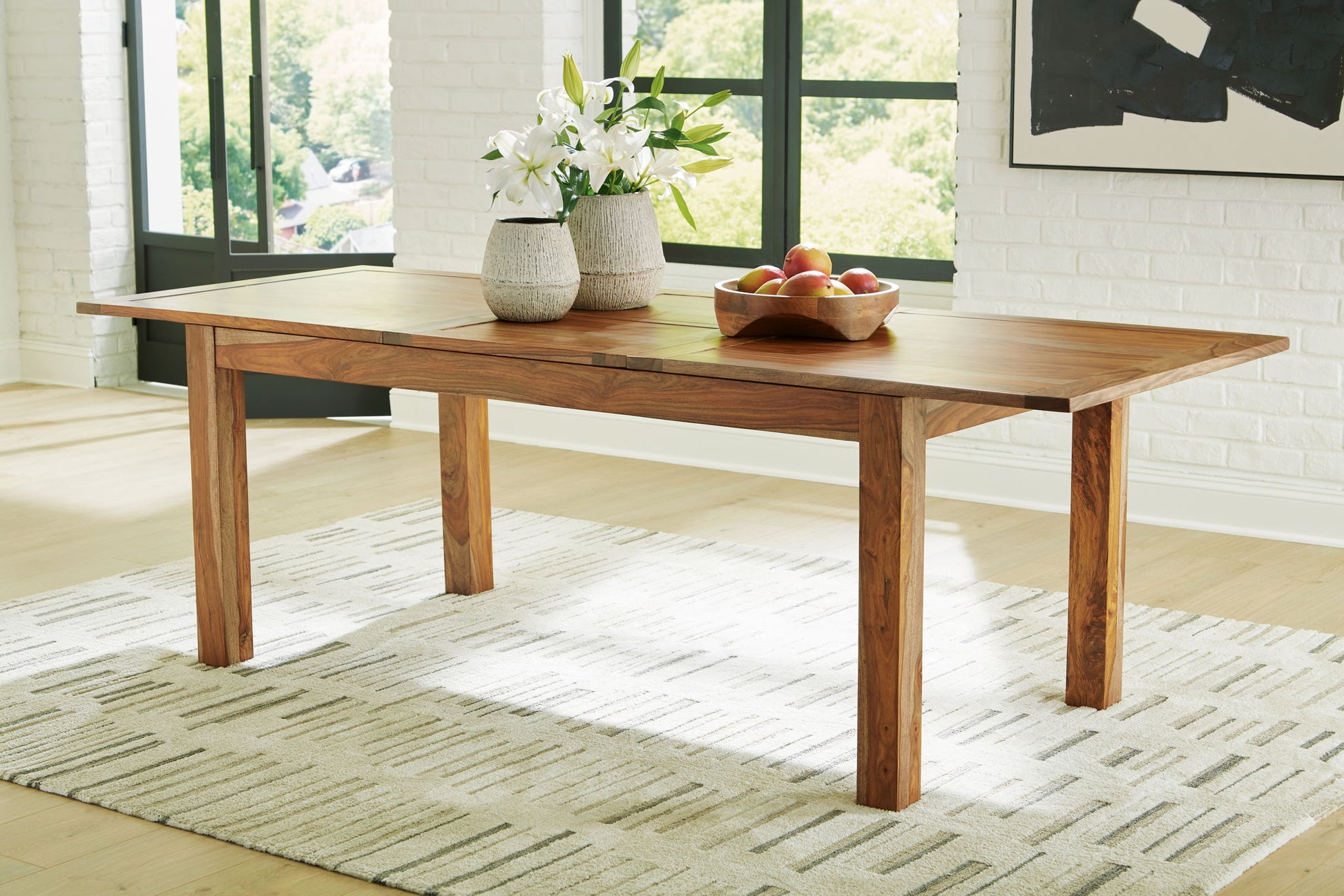Dressonni - Brown - Rectangular Dining Room Butterfly Extension Table - Hornell Furniture Outlet
