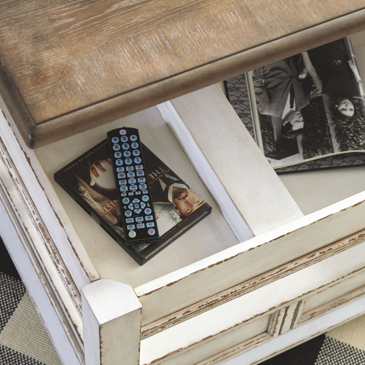 Realyn - White / Brown - Lift Top Cocktail Table - Hornell Furniture Outlet