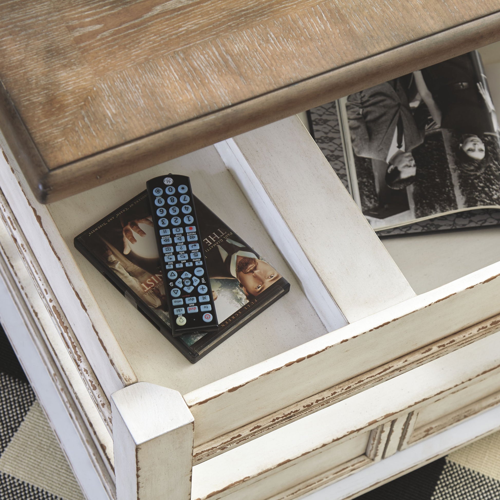 Realyn - White / Brown - Lift Top Cocktail Table - Hornell Furniture Outlet