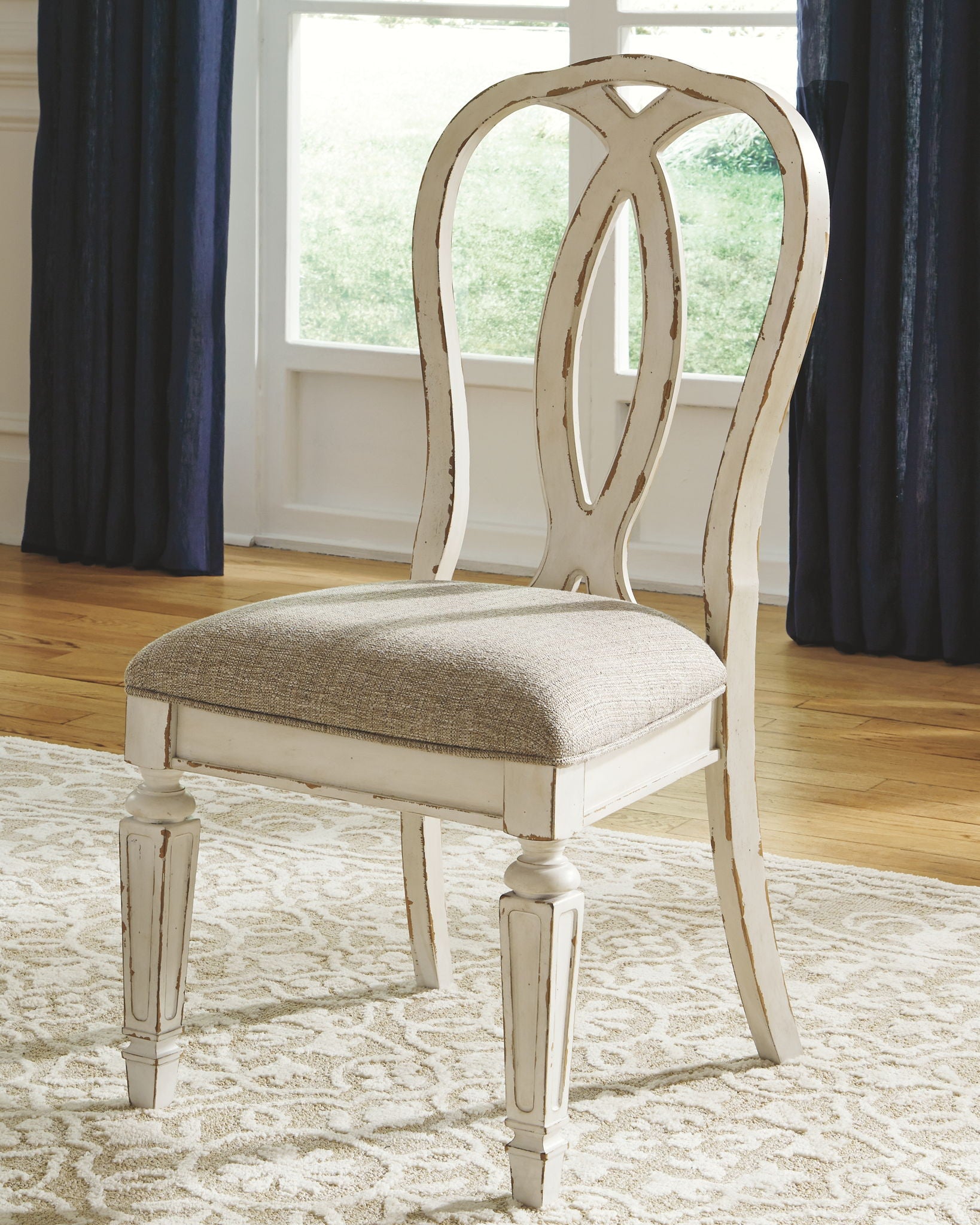 Realyn - Oval Dining Table Set - Hornell Furniture Outlet